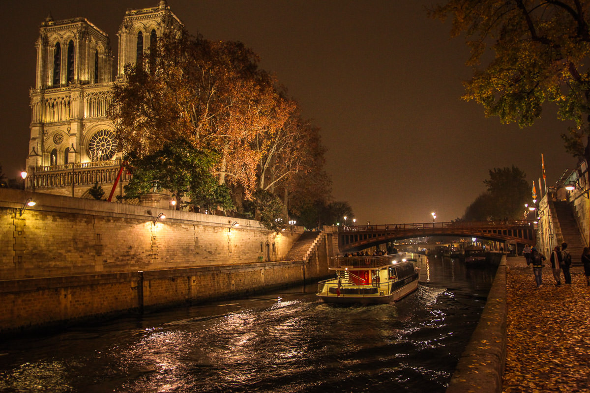 boat past Notre-Dame Paris