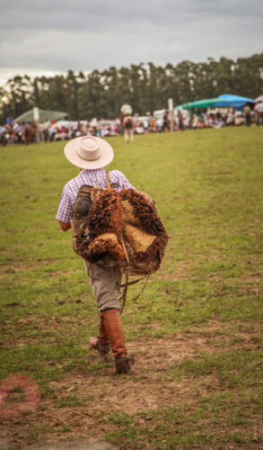 Carnival festa Garzón boy with saddle