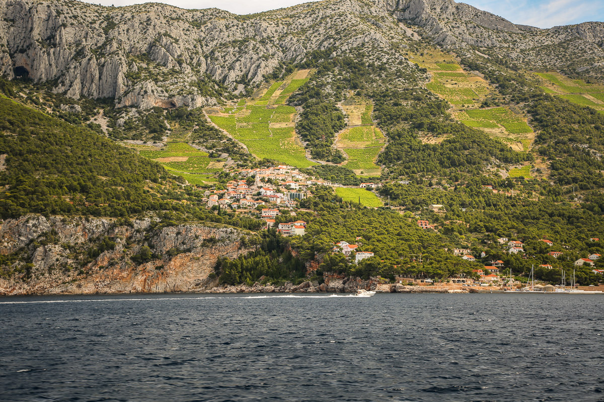 Sailing past mountain town Croatia