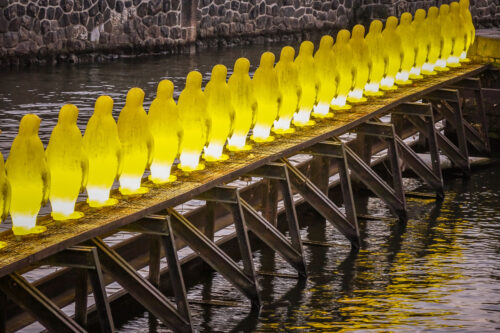 Cracking Art Group penguins Prague at dusk