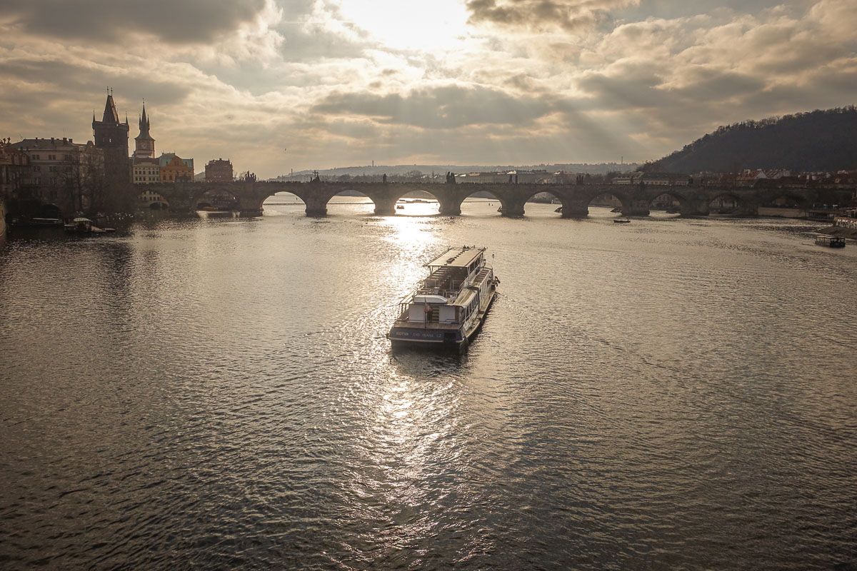 Boat on Vltava River sunset