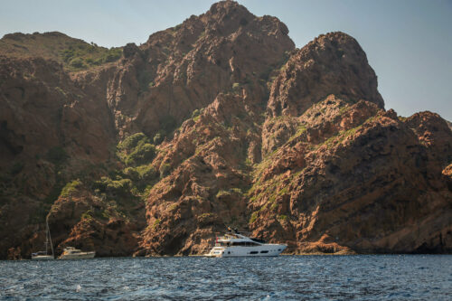 Scandola Nature Reserve boat against cliff