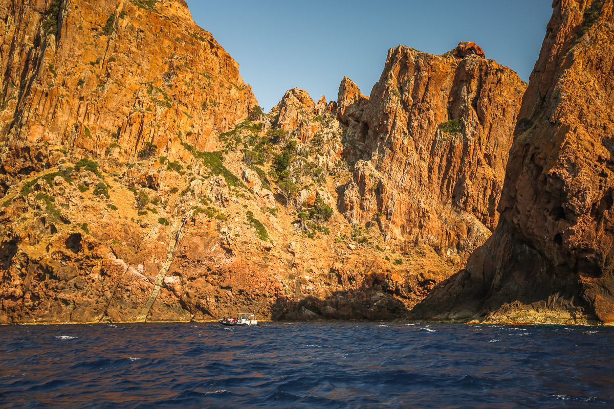 Scandola Nature Reserve boat against cliff