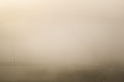 view of Dom Luís bridge in clouds Porto