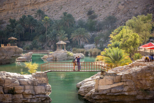 people on bridge Wadi Bani Khalid Oman