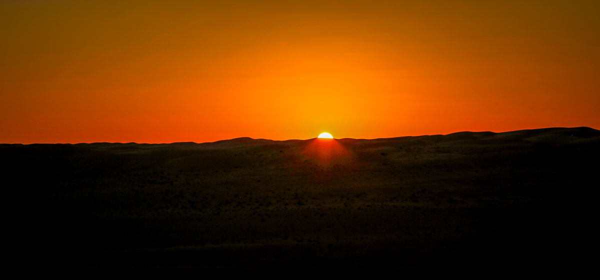 Setting sun Canvas Club Oman Wahiba Sands