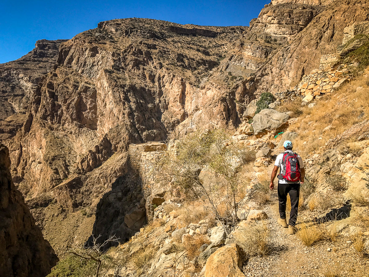 Hiking down into canyon Alila Jabal Akhdar