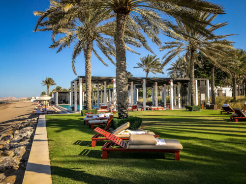 loungers by beach Chedi Muscat