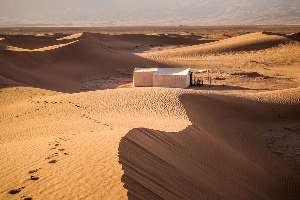 Dar Ahlam private tent camp tent at sunset