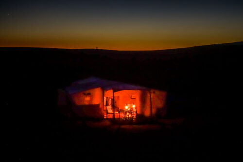 Dar Ahlam tent candles at twilight