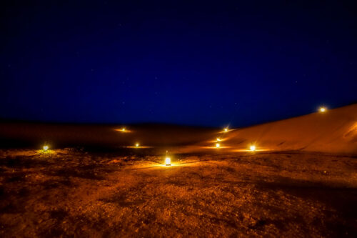 Dar Ahlam desert candles at night