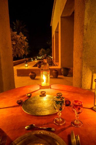 dining outdoors at night Dar Ahlam