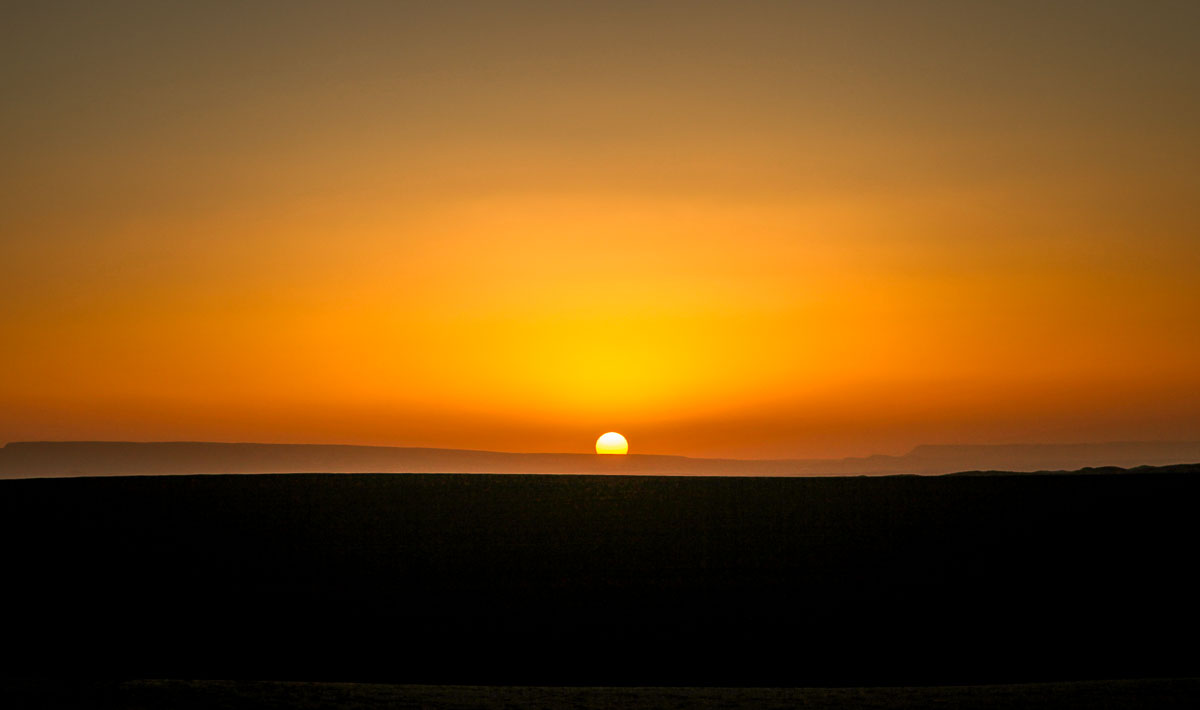 Dar Ahlam Sahara tent camp sunrise horizon