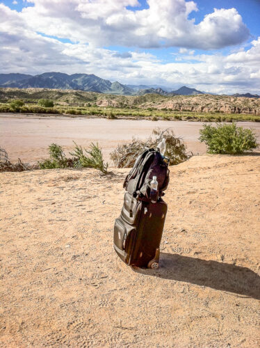 suitcase by river Molinos