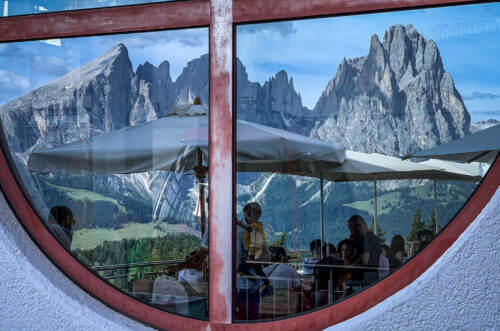 reflection of sassolungo cablecar cafe