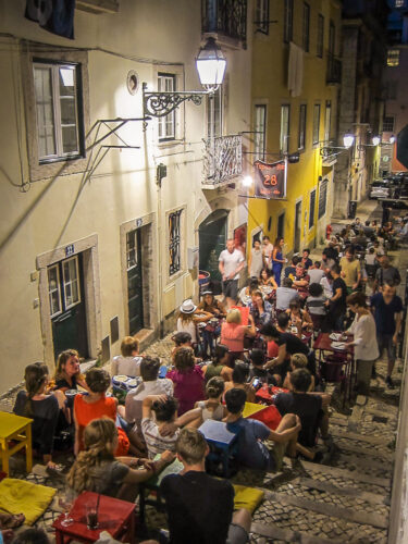 Tapas restaurant steps Lisbon crowds